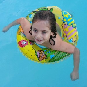 Child in solar heated pool